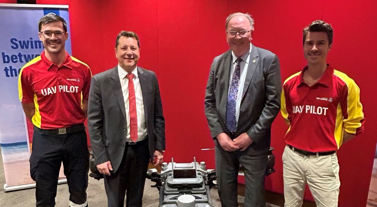 Dr Michael Holland MP, Member for Bega with Minister for Planning and Public Spaces Paul Scully and Surf Lifesaving Representatives pictured with a drone that is helping boost the capacity of Surf Life Saving NSW