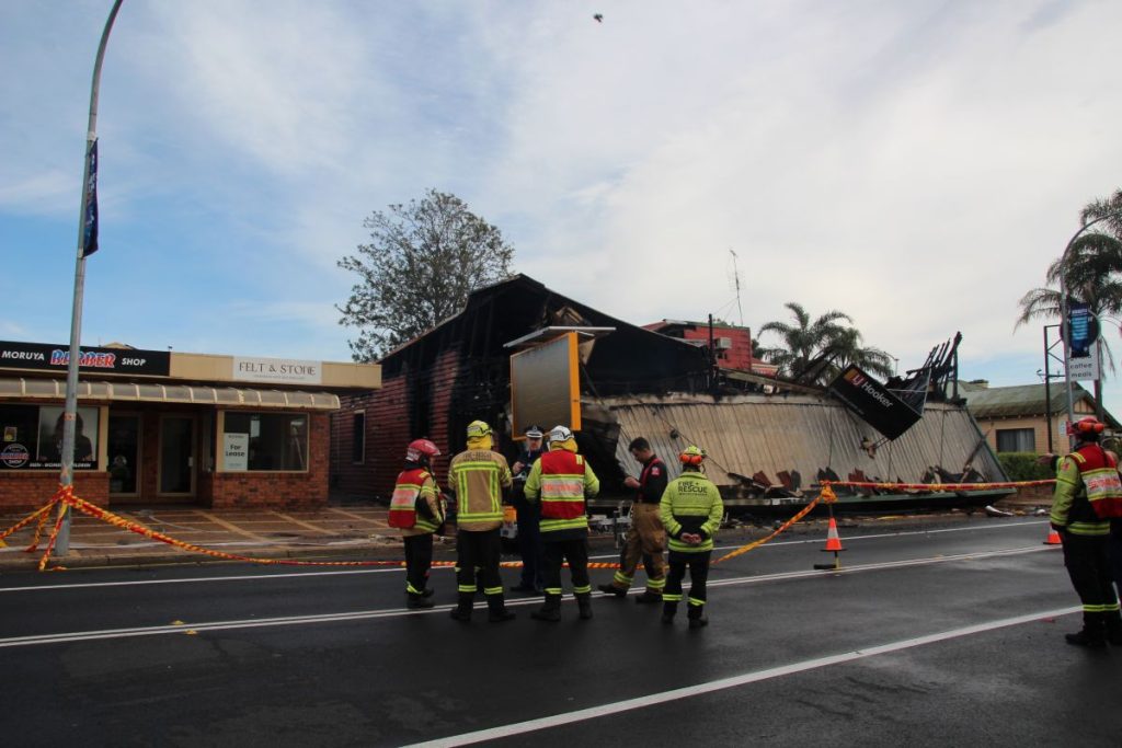 Mopping up after fire destroyed Vulcan St Moruya businesses